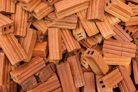 Heap of unarranged bricks for construction Stock Photos
