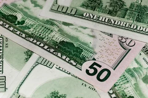 Heap of US dollars banknotes lying chaotically Stock Photos