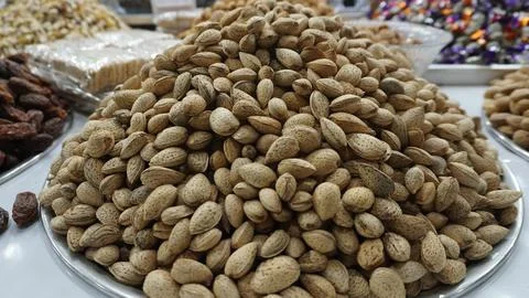 Heap of Whole Almonds in Shells Displayed at Local Dry Fruit Shop Фото