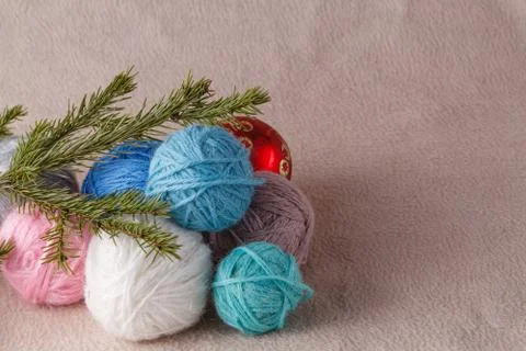Heap of wool clew on soft background with christmas decoration Stock Photos
