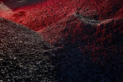Heaps of coal in the red light Stock Photos