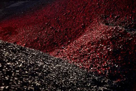 Heaps of coal in the red light Stock Photos