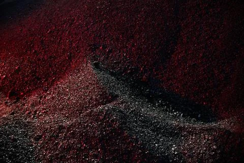 Heaps of coal in the red light Stock Photos