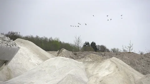 Heaps of limestones and a backhoe Stock Footage 38292755