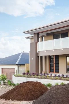 Heaps of manure and soil in front of a house Foto stock