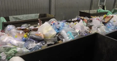 Heaps of miscellaneous unsorted waste in containers, plastic, cellophane, paper. 스톡 동영상 156028673