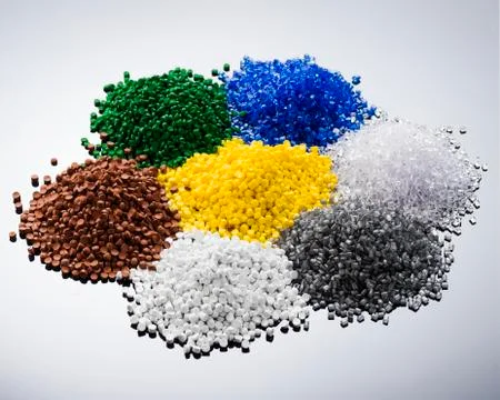 Heaps of multicolored plastic granules Stock Photos