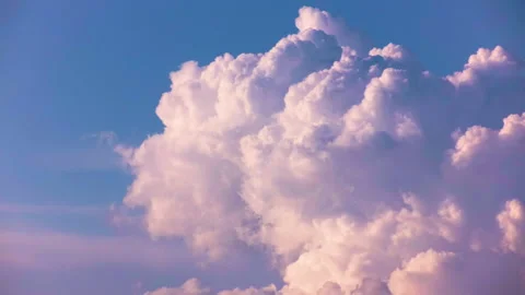 Heaps of pink clouds like thick smoke against the blue sky. Time laps. Stock Footage 142078199