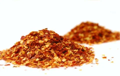Heaps of red pepper flakes Stock Photos