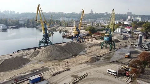 Heaps of sand. river. copter flies over cargo cranes. sand quarry Stock-Footage 141897743