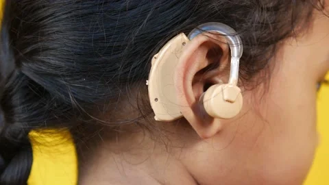 Hearing aid concept, a kid with hearing problems. Stock Footage 168817858