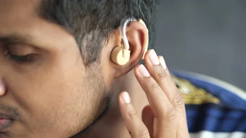 Hearing aid concept, a young man with hearing problems. Stock Footage 158374014