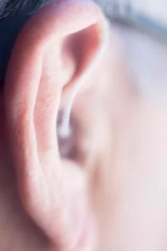 Hearing aid in ear Stock Photos