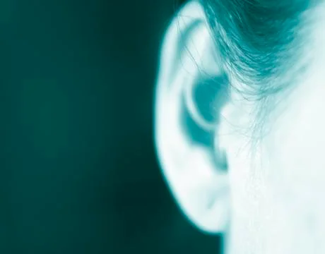 Hearing aid in ear Stock Photos