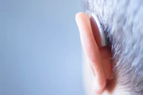 Hearing aid in ear Stock Photos