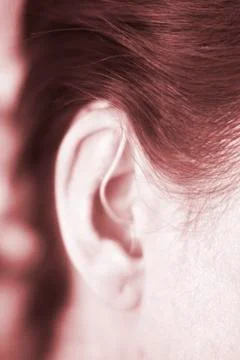 Hearing aid in ear Stock Photos