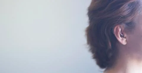 Hearing aid in ear Stock Photos