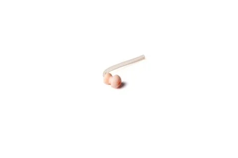 Hearing aid replacement eartip dome with silicone tube isolated on white Stock Photos