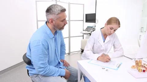 Hearing aids. Behind-the-ear hearing aids are recommended by audioprosthetist Stock Footage 327118380