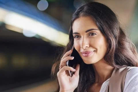 Hearing great news while commuting. Cropped shot of a young attractive woman on Stock Photos