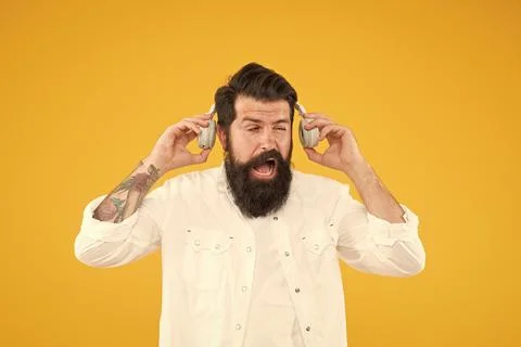 Hearing problem. Bearded man headphones. Active Noise Cancellation Technology 写真素材