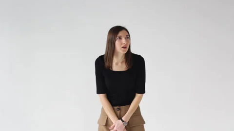 Hearing problems, deafness. A pretty brunette holding her hand next to me and as Video stock 172443399