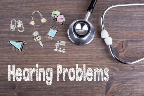 Hearing Problems. Workplace of a doctor. Stethoscope on wooden desk backgroun Stock Photos