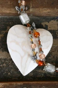 Heart and beads Stock Photos