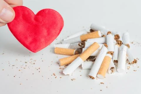 Heart and broken cigarettes. Quit smoking Stock Photos