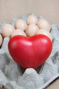 Heart and eggs on paper pattern wood Stock Photos