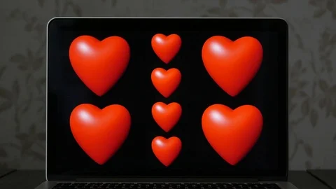 Heart animation loop with black a background on a laptop screen Video stock 76549793