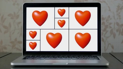 Heart animation loop with white background on laptop screen Video stock 76697174