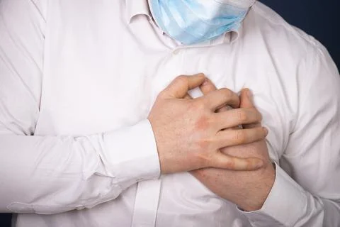 Heart attack concept. Man suffering from chest pain, closeup Stock Photos