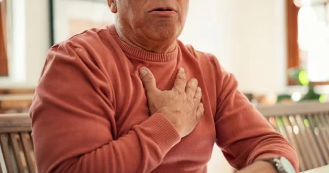 Heart attack, zoom and senior man in his home coughing, problem or breathing Stock Footage 254837943