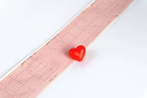 Heart on the background of the cardiogram. Stock Photos
