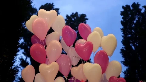 Heart balloons swinging in the wind Stock Footage 101746258