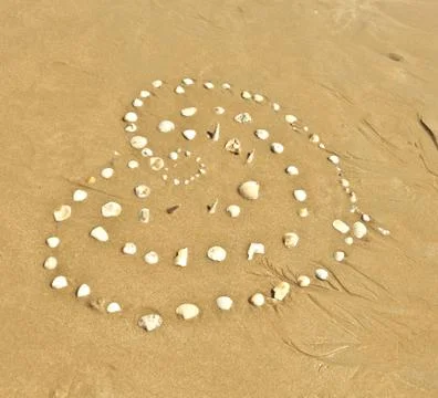Heart on beach Stock Photos
