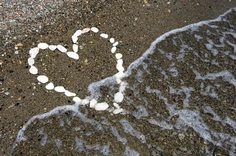 Heart on beach Stock Photos