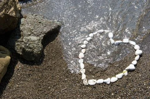 Heart on beach Stock Photos