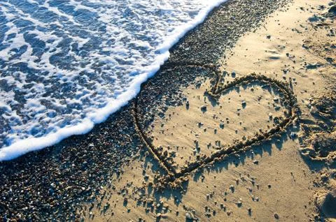 Heart on beach Stock Photos