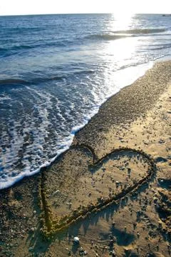 Heart on beach Stock Photos