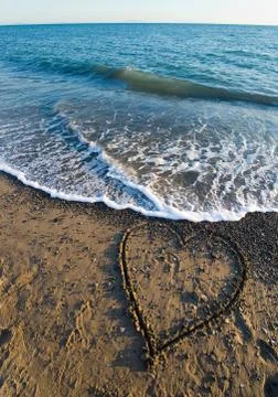 Heart on beach Stock Photos
