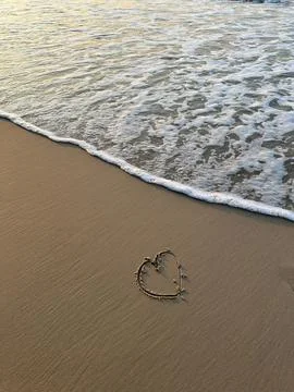 Heart on the beach Stock Photos