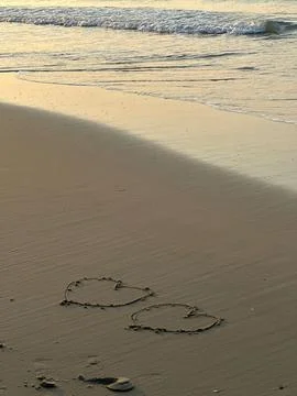 Heart on the beach Stock Photos