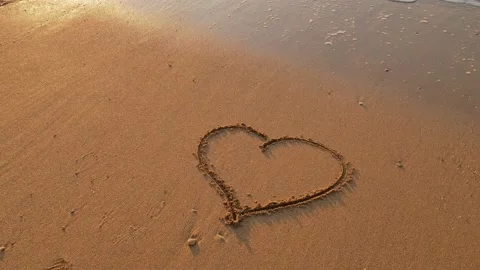 Heart on the beach sand . Stock Footage 169226219