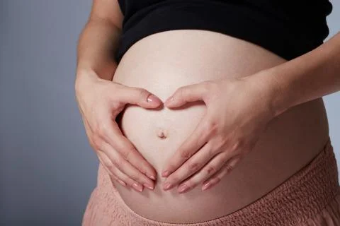 Heart on belly Stock Photos