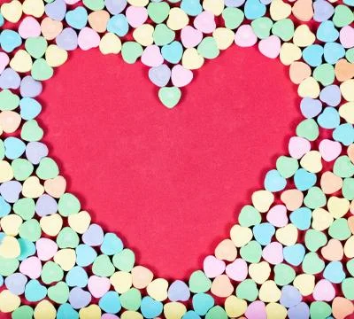 Heart blank space with colorful candies on outside Foto stock