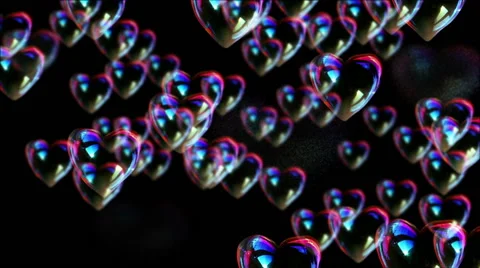 Heart bubbles burst on black background Stock Footage 63395592