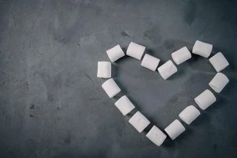 Heart. Candy, top view flat lay, pattern marshmallow on dark background. Ca.. Stock Photos