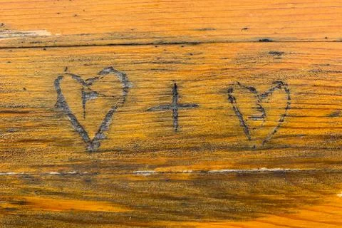 Heart carved on the table Stock Photos